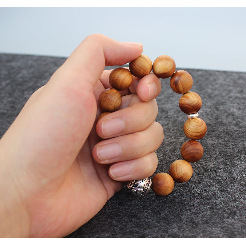 Buddhist Handcrafted Nature Sandalwood Bracelet for "Power & Adventure" (with Traditional Dragon Amulet)