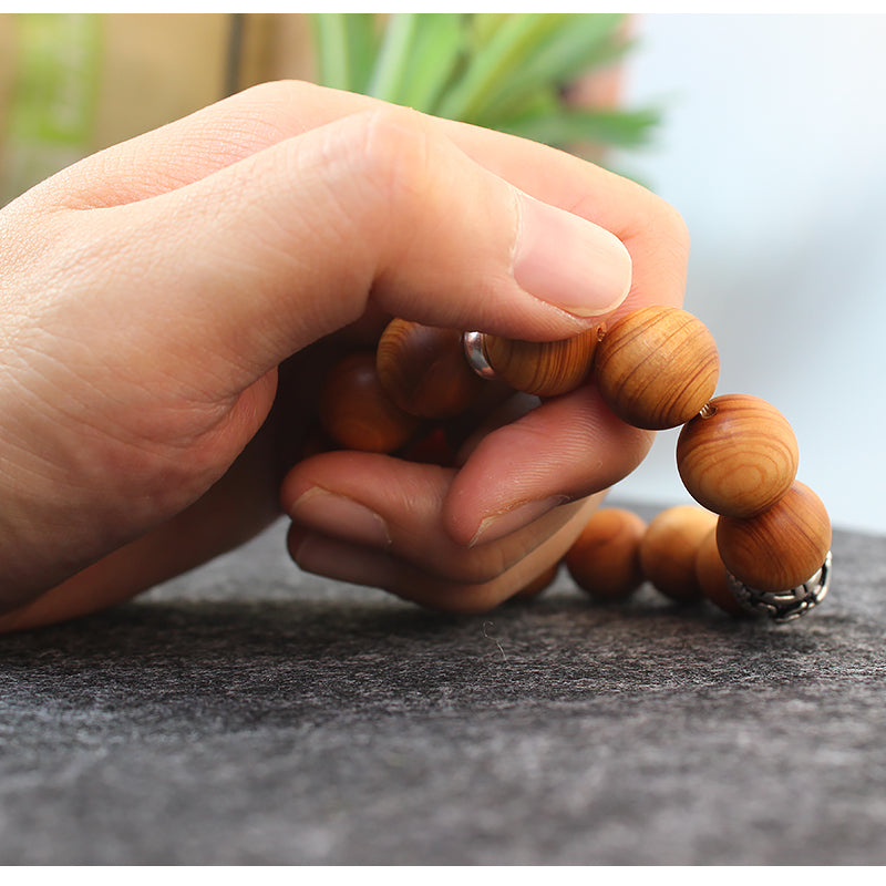 Buddhist Handcrafted Nature Sandalwood Bracelet for "Power & Adventure" (with Traditional Dragon Amulet)