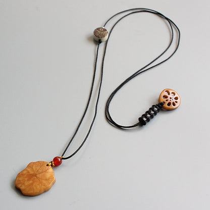 Protective Lotus Pendant (Tagua Nut)