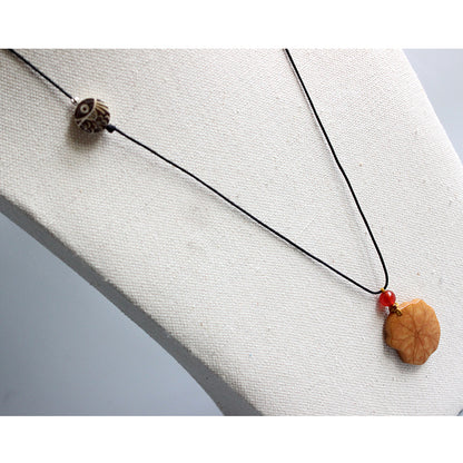 Protective Lotus Pendant (Tagua Nut)