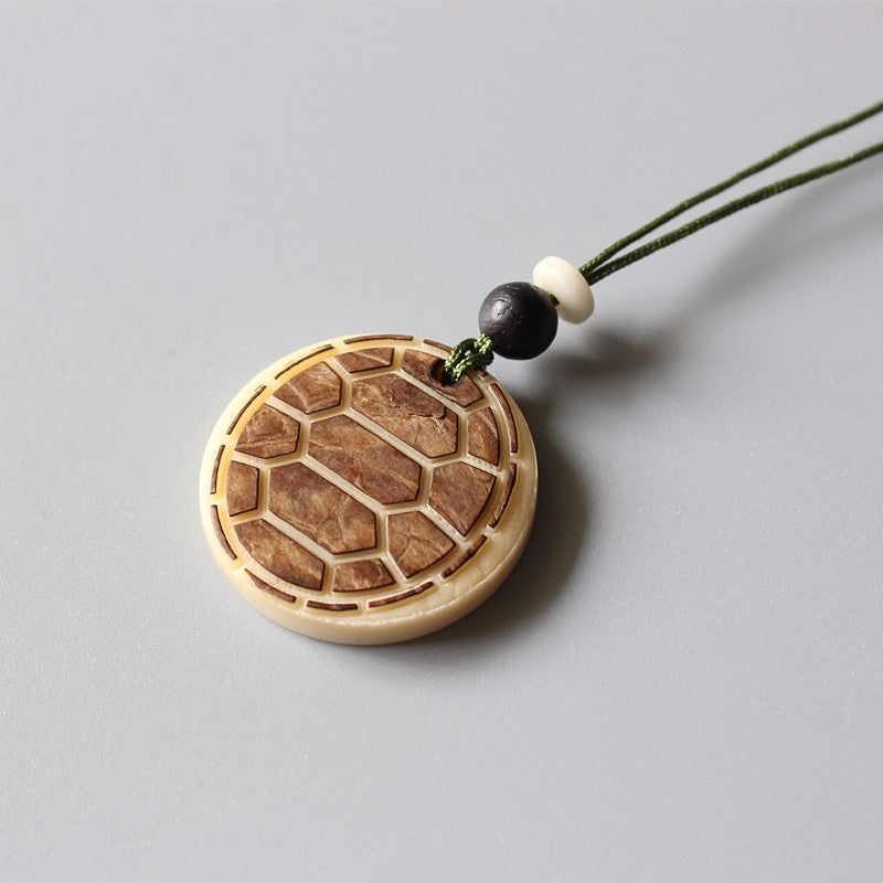 Artisan Carved Harmony Pendant (Tagua Nut)